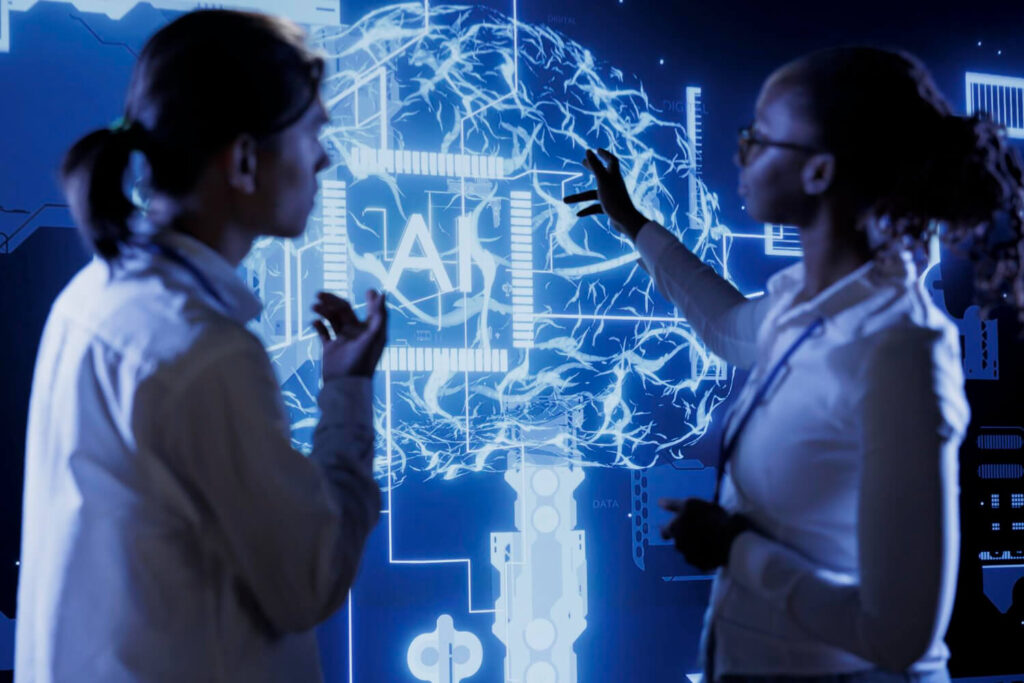 As 50 Empresas de IA Mais Promissoras do Mundo Segundo a Lista da Forbes 19 Dois profissionais analisam um painel interativo, representando empresas de IA mais promissoras.